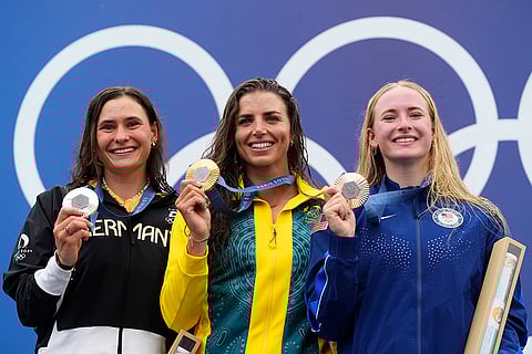 Women's canoe single medal ceremony: Gold medalist Jessica Fox, center, with silver medalist Elena Lilik, left, and bronze medalist Evy Leibfarth,